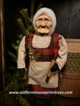 #OTC23-7 Primitive Mrs Santa Claus 🧑‍🎄 Wearing Red Plaid Coat Holding Wreath