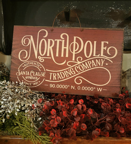 #RNP915 Festive Red "North Pole Trading Company" Wood Sign On Wire