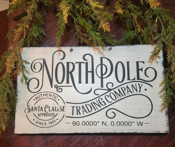 #WNP915 White "North Pole Trading Company" Sign On Wire